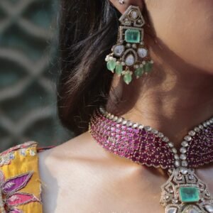Ruhi Crimson Choker Set with original Kiyani Kundan and green accents worn with matching earrings