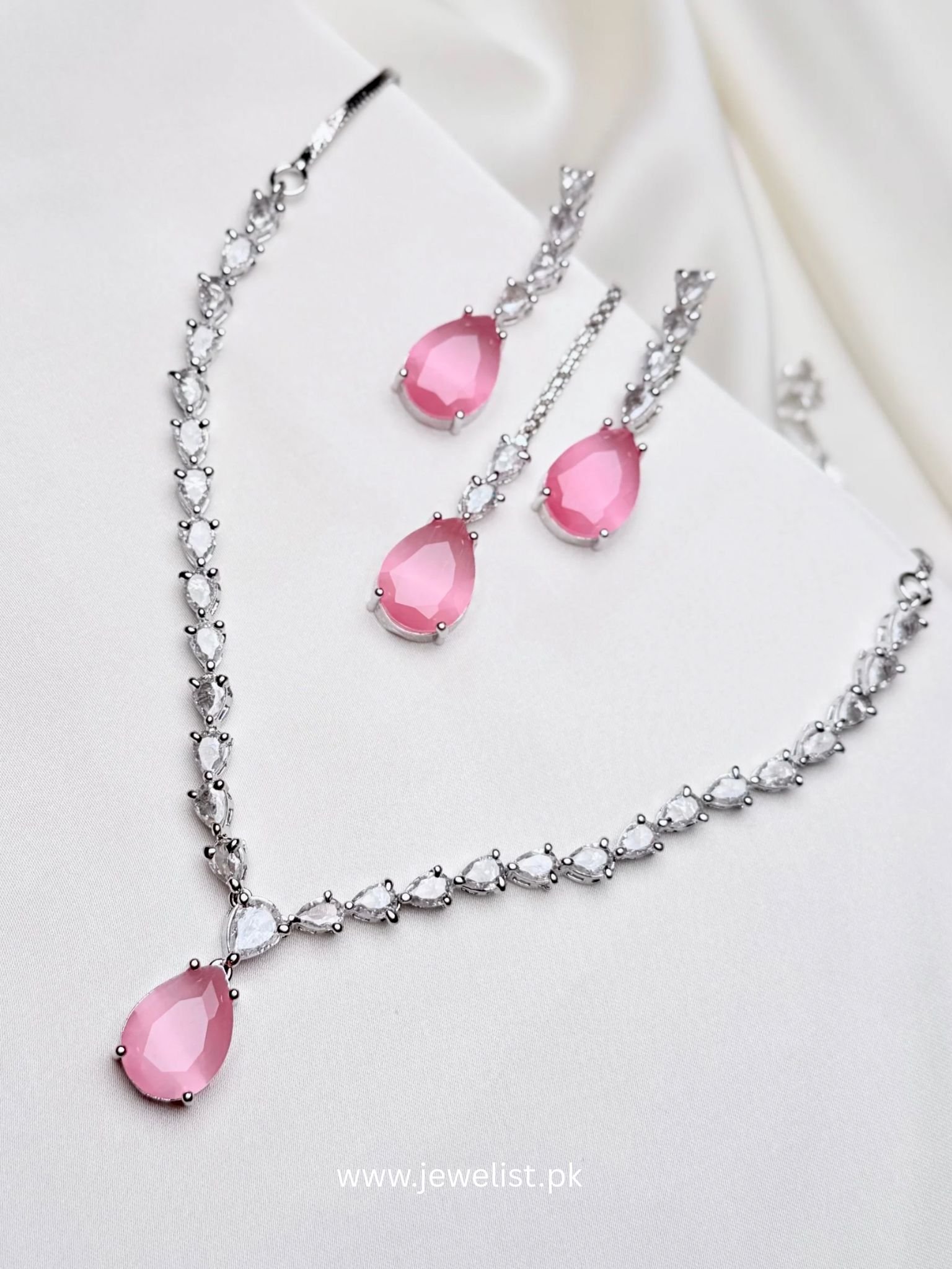 Nouveau Set pink teardrop necklace earrings and teeka with clear crystal-inspired accents