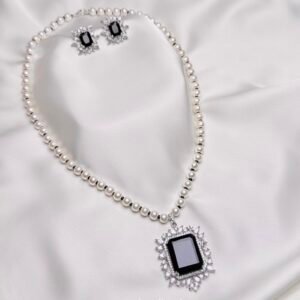 Ophelia Pearl Pendant Suite black rectangular pendant with crystal halo white pearl-like necklace and matching earrings