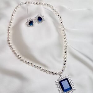 Ophelia Pearl Pendant Suite blue rectangular crystal halo pendant with white pearl-like necklace and stud earrings