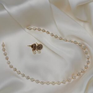 Rosette Trail Mala Set close-up with gold-tone floral clusters and pearl-like drop earrings