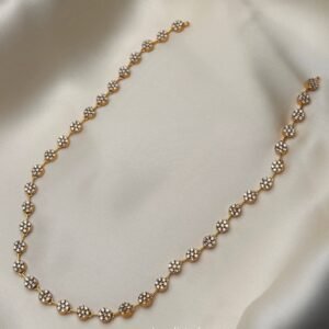 Rosette Trail Mala Set with gold-tone floral necklace and pearl-like drop earrings