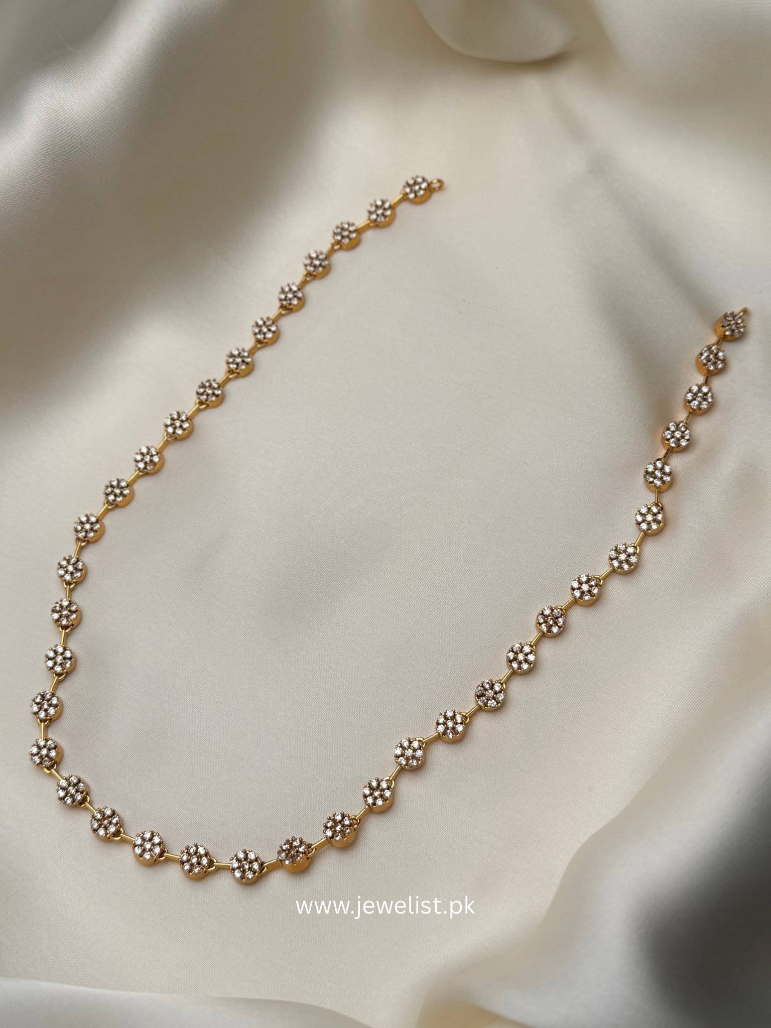 Rosette Trail Mala Set with gold-tone floral necklace and pearl-like drop earrings