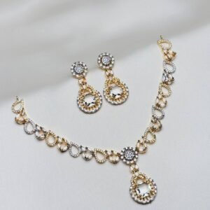 Teardrop Halo Necklace Set in gold and silver tone with clear geometric pendant and matching earrings