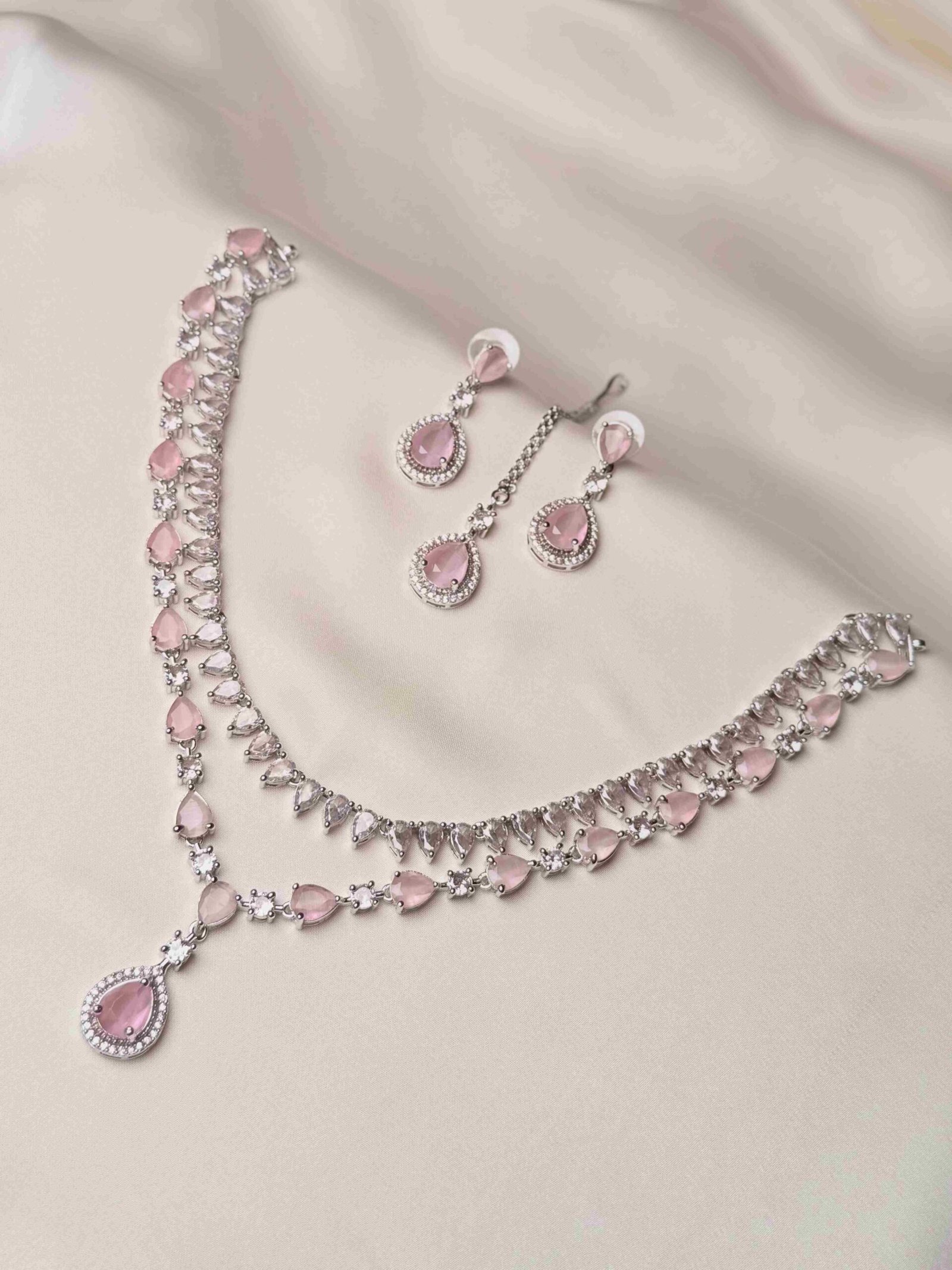The Iris Cascading Set pink teardrop necklace earrings and teeka