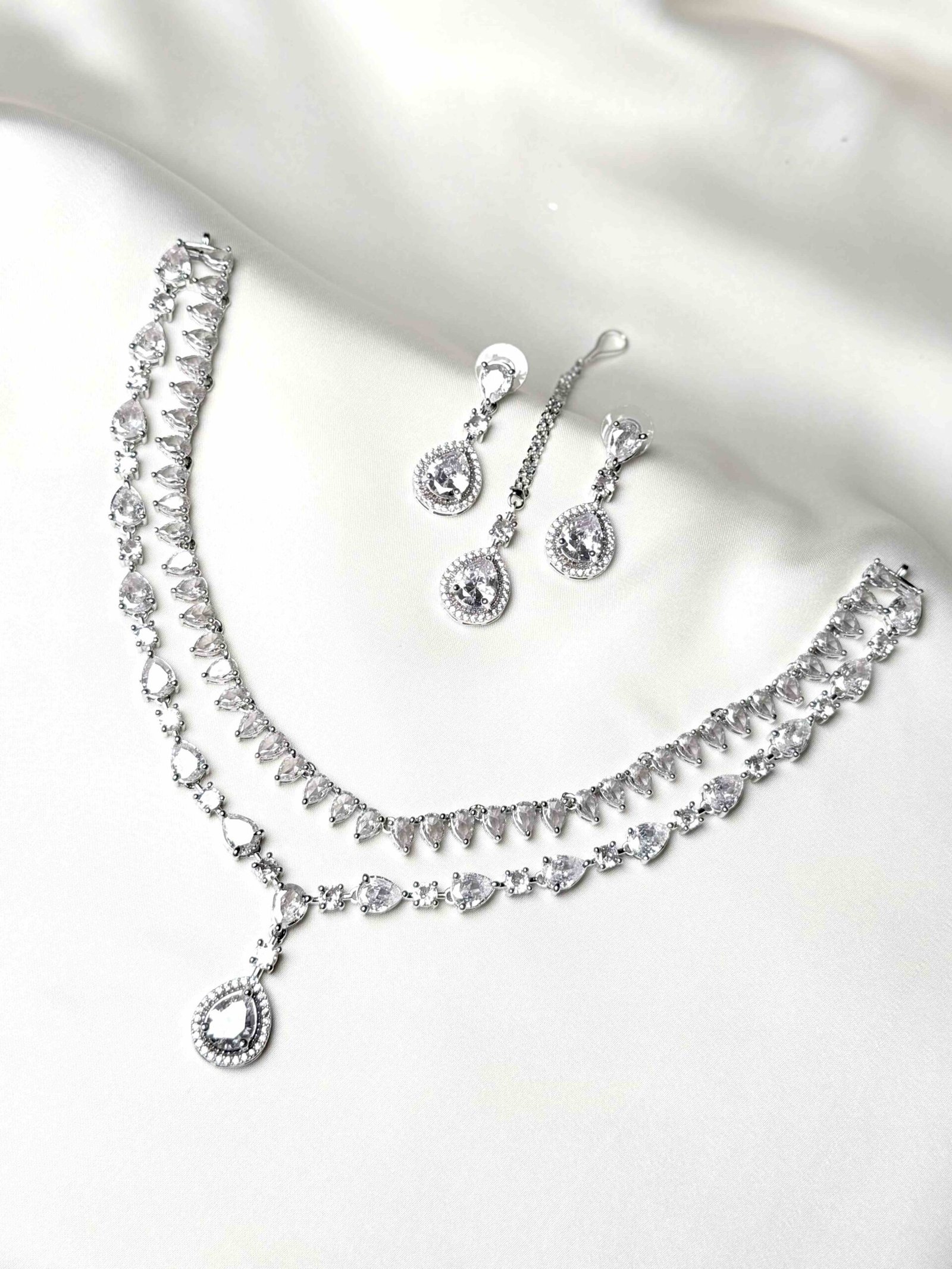The Iris Cascading Set pink teardrop necklace earrings and teeka