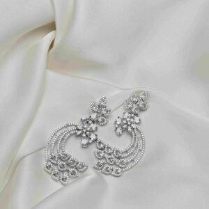Crescent Leaf Earrings full pair on ivory fabric with silver-tone open crescent design and sparkling leaf-shaped accents