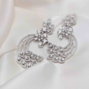 Crescent Leaf Earrings close-up showing silver-tone floral clusters, three sparkling crescent arcs and decorative leaf motifs