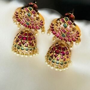 Gulaal Jhumkis traditional gold-tone earrings with pink and green accents, ornate dome drops and creamy pearl-like bead fringes.