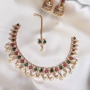 Mehr Moti Choker Set with pink green accents, jhumka earrings, teeka and pearl-like drops