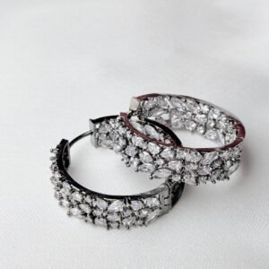 Crystal Bloom Hoops oxidized silver-tone statement earrings with floral-inspired clear sparkling accents in overlapping close-up view