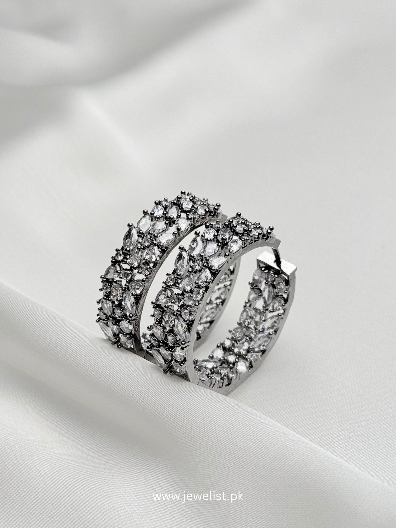 Crystal Bloom Hoops upright silver-tone statement earrings with marquise-shaped clear accents and decorative curved hoop design