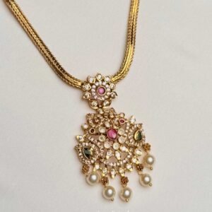 Gold Tone Pearl Drop Pendant Necklace angled view showing braided chain and ornate pendant